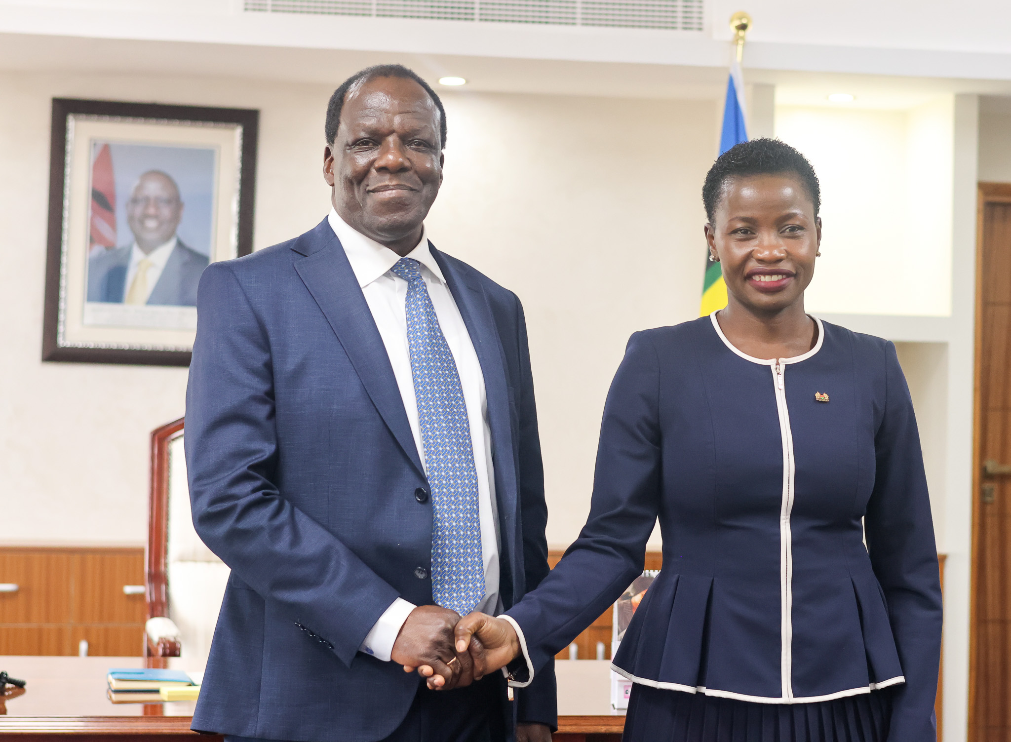 Newly appointed CS. Hon Wyclifee Oparanya handshakes PS. MSME Development Hon. Susan Mang'eni