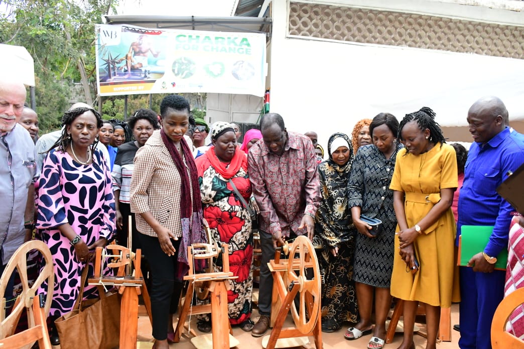 Hon. Oparanya and Hon. Mang'eni interact with silk spinners