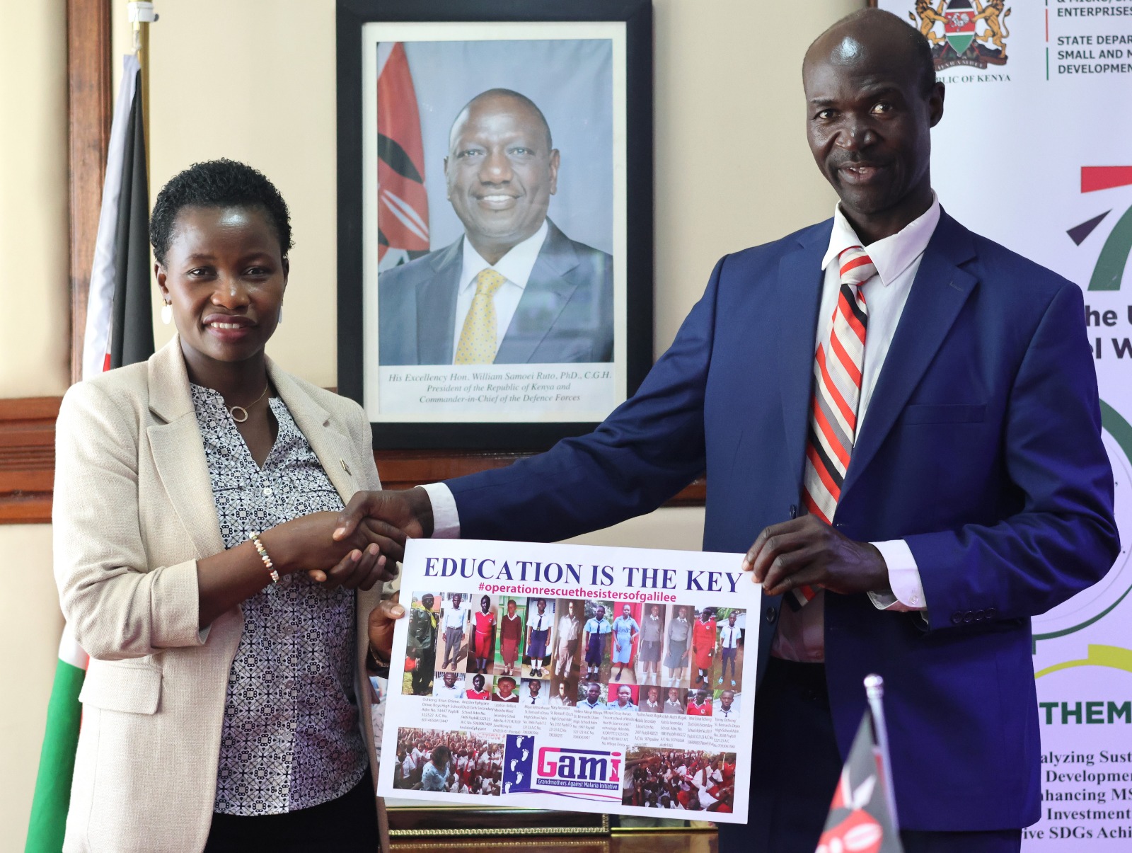 Hon. Susan Mang'eni, CBS handshakes Dr. Tom Mboya Owino