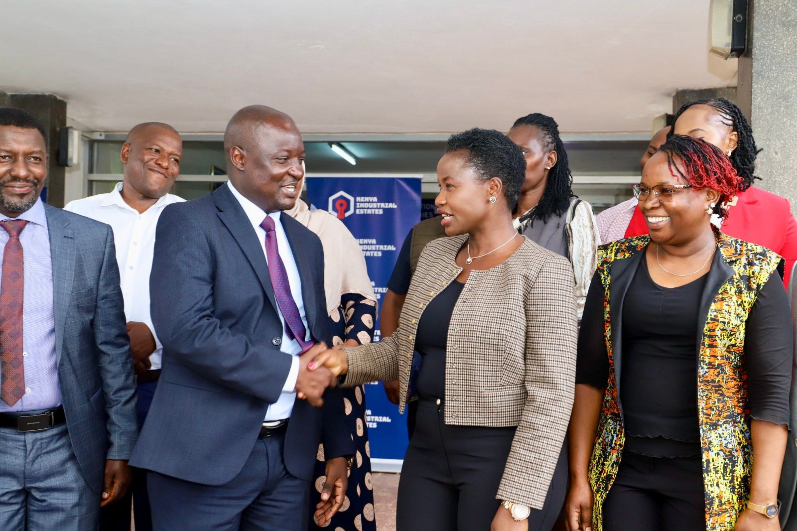 Principal Secretary Hon. Susan Mange'ni handshakes newly appointed Managing DirectorNelson Kwamini 