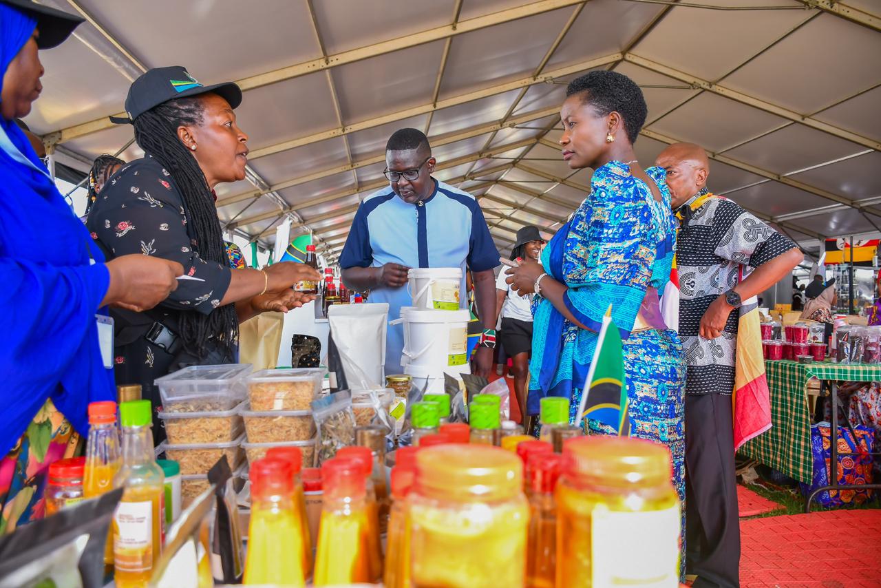 PS MSMEs Development alonside Churchill view showcased products at the EAC MSMEs Trade Fair, Uganda Day