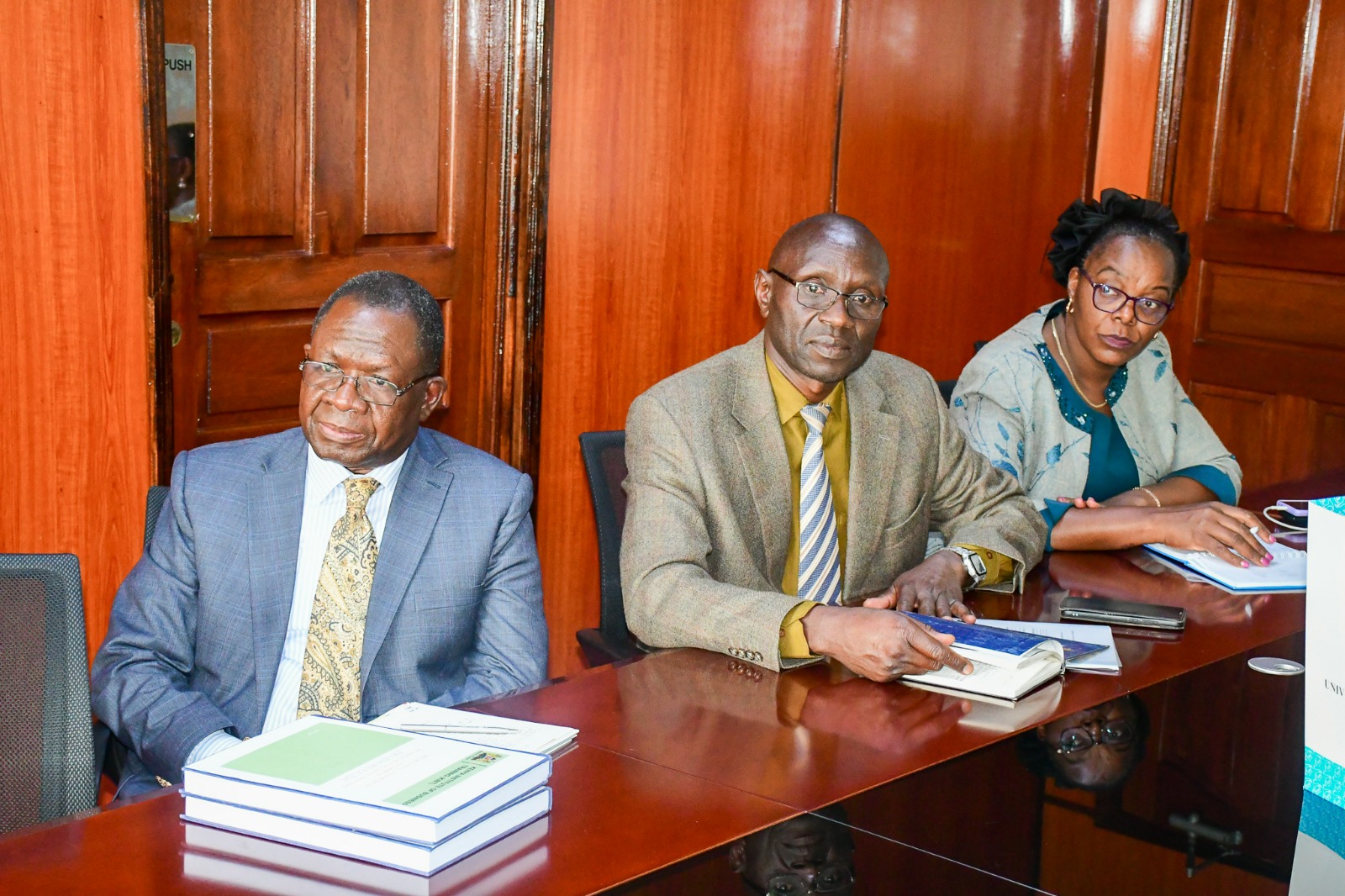 Hon. Susan Mang'eni being presented to MSMEs Development Training Manual