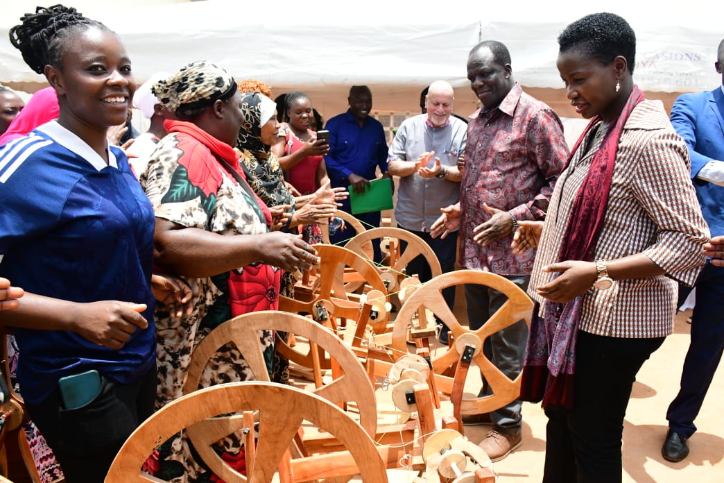 CS. Hon Wylcliffe Oparanya and Hon. Susan Mang'eni interact with spinners wheel
