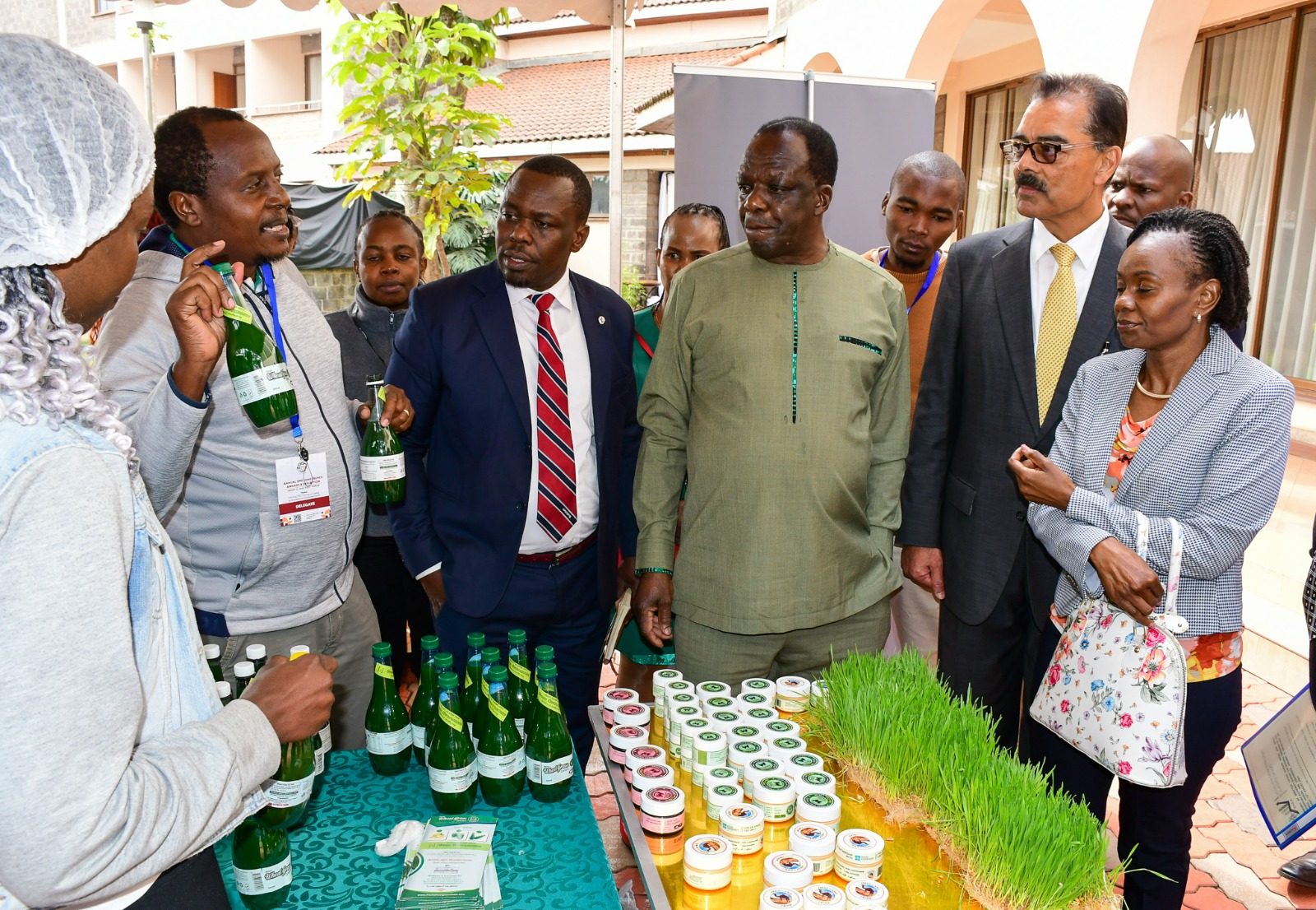Hon. Oparanya visiting stands at the SME Confrence, Awards and Exhibitions alonside other delegates
