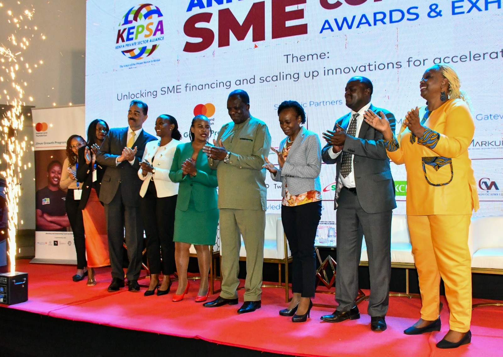 Hon. Oparanya visiting stands at the SME Confrence, Awards and Exhibitions alonside other delegates