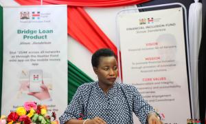 Hon. Susan Mangeni, CBS at the Financial Inclusion Fund booth
