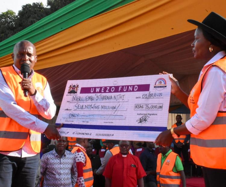 Deputy President Prof. Kithuri Kindiki issues out cheque at the Embu Bodaboda Strategic Plan