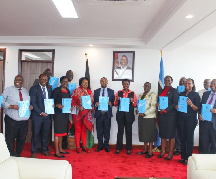 Principal Secretary alongside various Departmental Heads